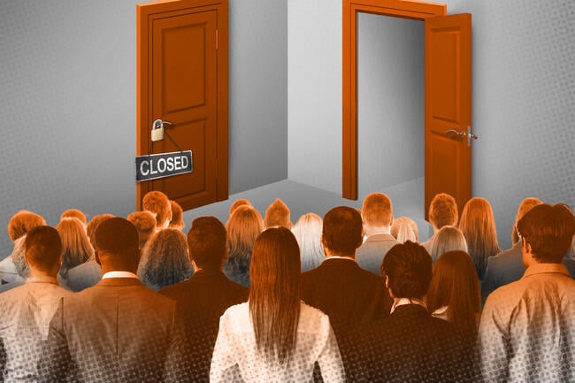 A group of faculty standing in front of two doors, one closed and one open.