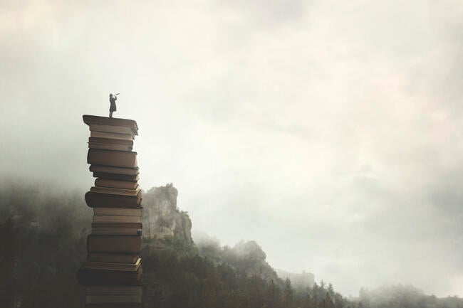 A drawing of a woman standing with a telescope on top of a stack of books in the mountainous outdoors, suggesting education as a path to freedom.