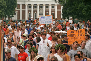 A photo of a dense crowd of people participating in a rally protesting the firing of University of Virginia president Teresa Sullivan on UVA's lawn in 2012. 