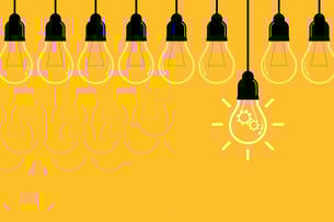 An illustration of a nine hanging lightbulbs against a yellow background; one bulb hangs lower and brighter than the other, suggesting a great idea or innovation.