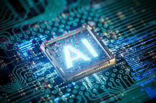 The letters "AI" are lit up on a circuit board.
