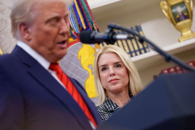 President Trump speaks at a podium while Attorney General Pam Bondi looks on, smiling, in a photo taken in February in the Oval Office.