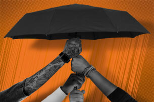 A bunch of hands all holding up an umbrella.