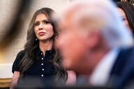 Homeland Security Secretary Kristi Noem listens to President Donald Trump.