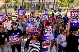 Loyola Marymount workers holding up signs for the union