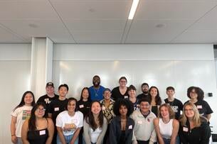 Students pose for a group photos at the Newbury Center at Boston University.
