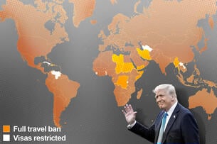 President Donald Trump in front of a map of the world.