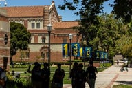 People walk around UCLA campus.