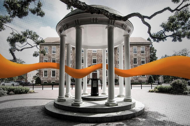 An orange band weaves through the Old Well columns located on the University of North Carolina at Chapel Hill's campus.