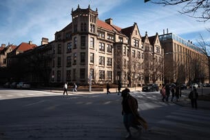 People walk on the campus of the University of Chicago.
